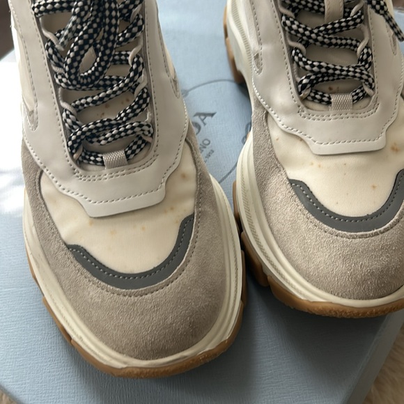 Prada sneakers It has a couple of little spots on it that’s cleanable. - Picture 5 of 12